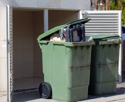 Front view of a Twickenham street with a skip ready for hire